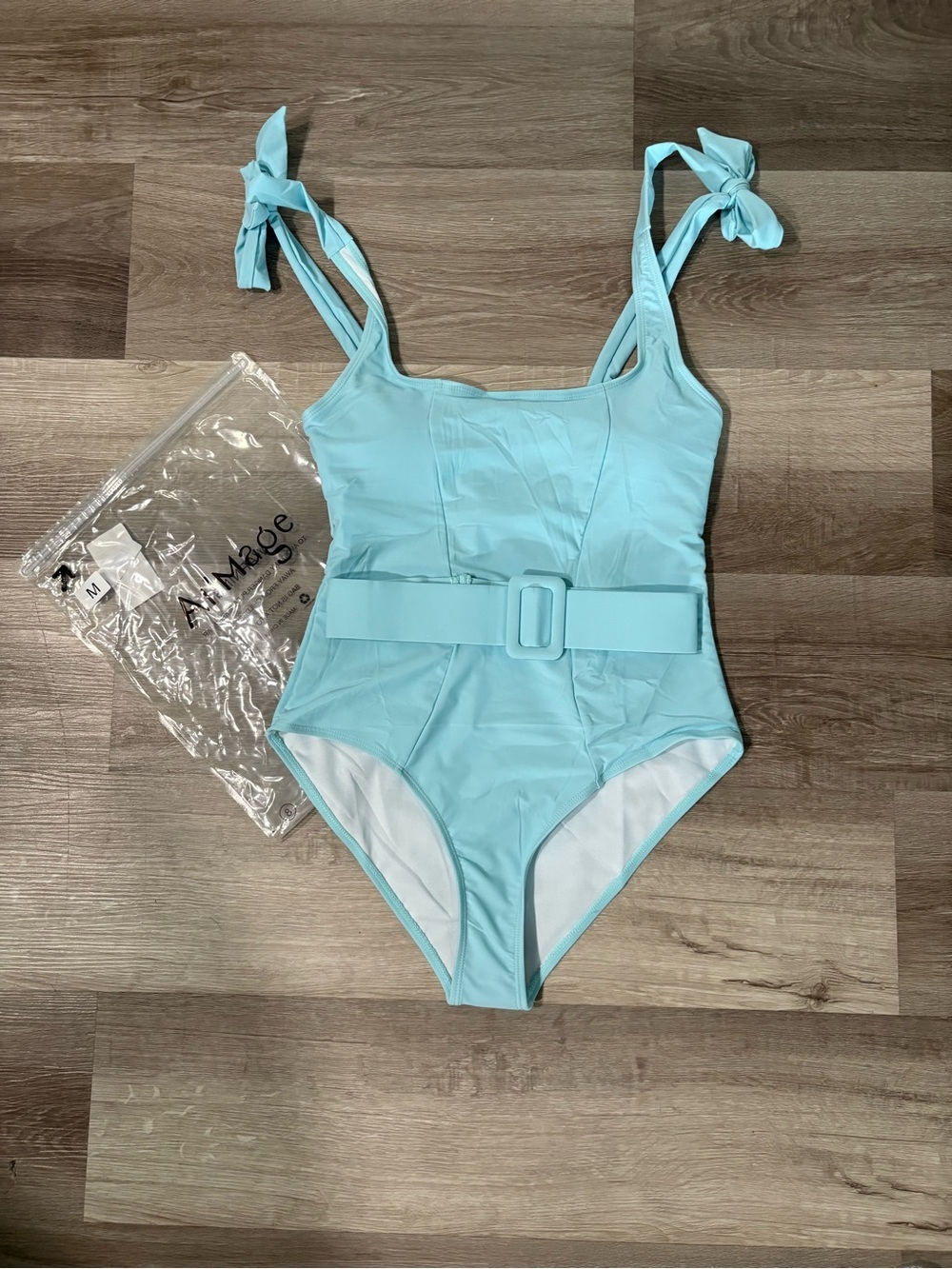 NWT Light Blue Belted One-Piece Swimsuit. Womens size medium